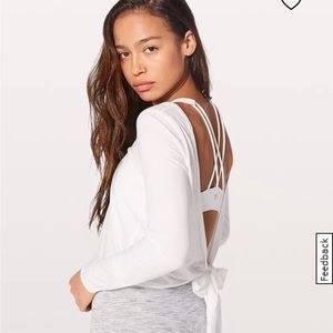 Lululemon it’s a tie long sleeve white top.